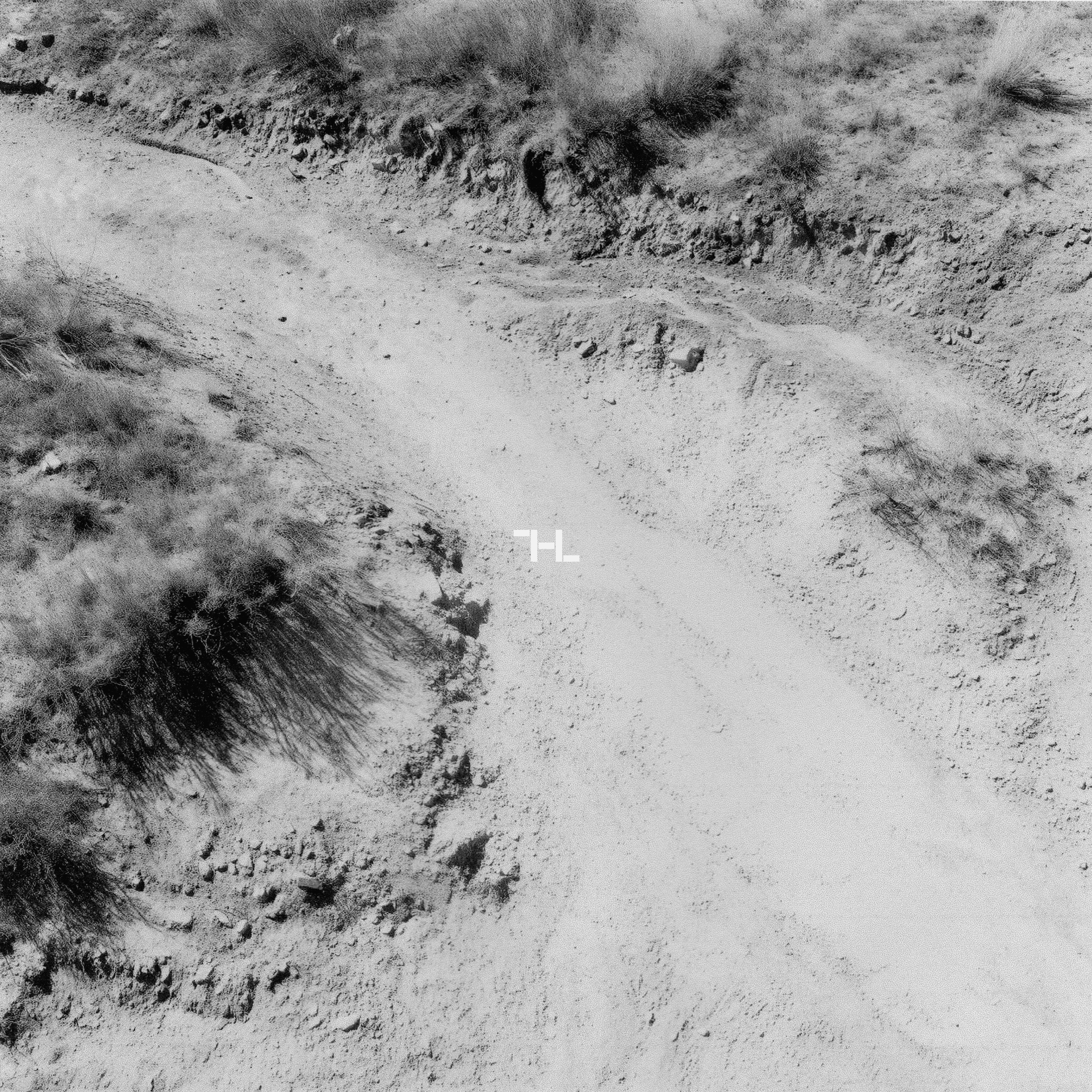 High & Low Engineering mark on aerial desert terrain