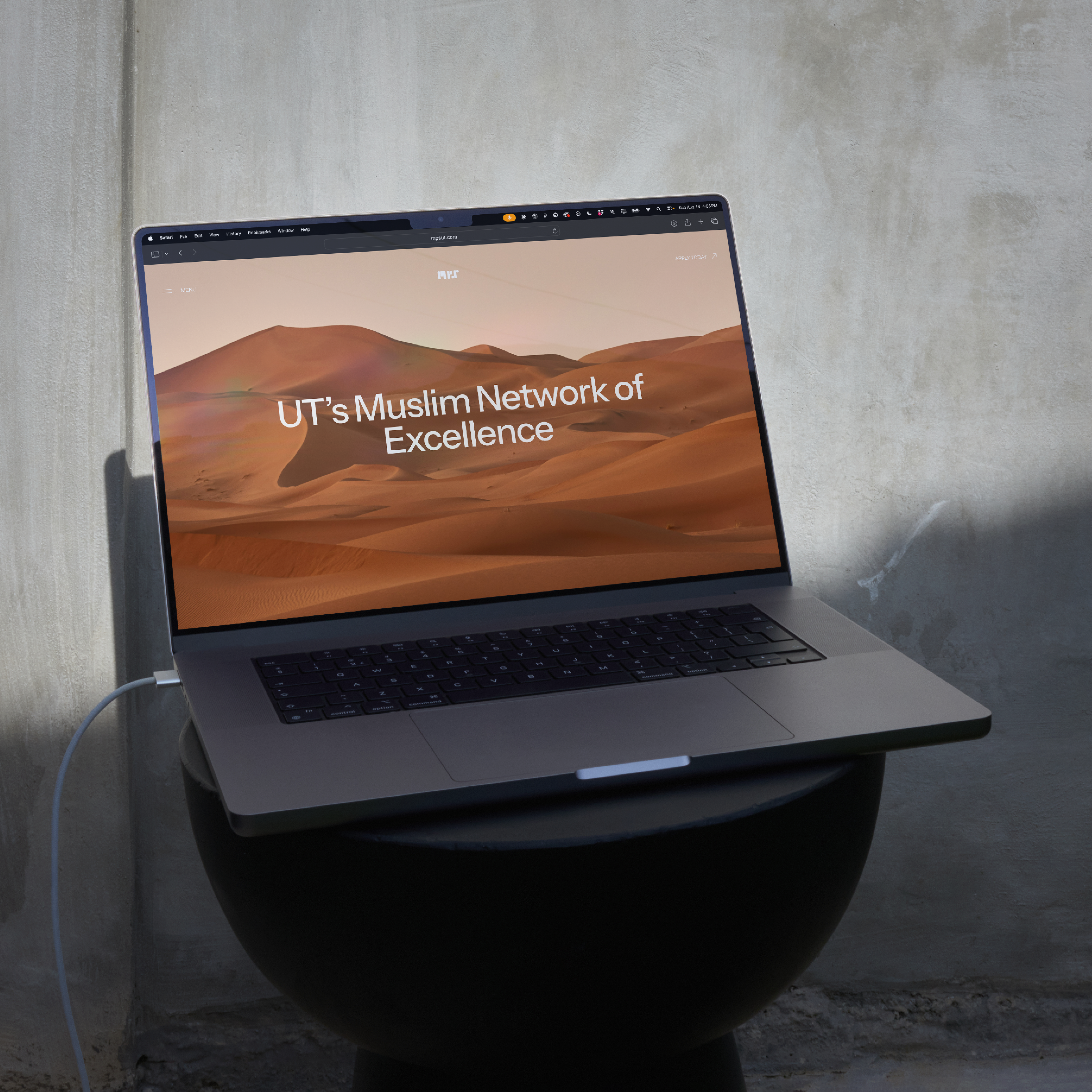 Laptop on a stool showing the MPS website